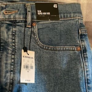 Raw hem slim super high rise Express jeans with black floral detail, NWT!